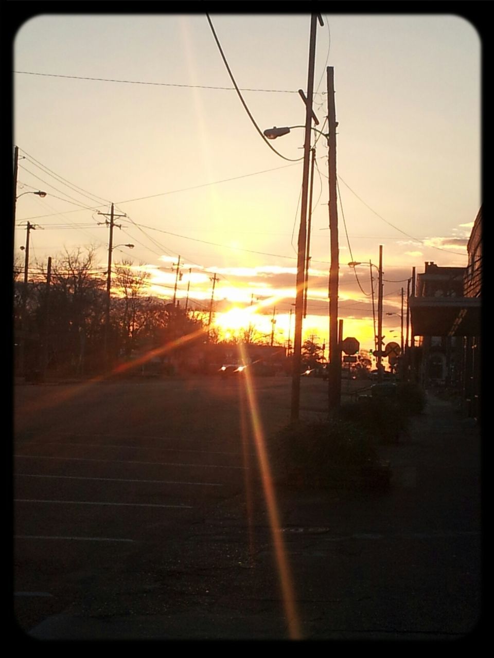 sunset, sun, electricity pylon, power line, sunlight, transfer print, the way forward, sky, transportation, orange color, silhouette, sunbeam, power supply, electricity, lens flare, railroad track, diminishing perspective, connection, auto post production filter, built structure