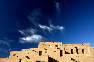 Low angle view of historical building against blue sky