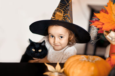 Portrait of cute baby girl in halloween