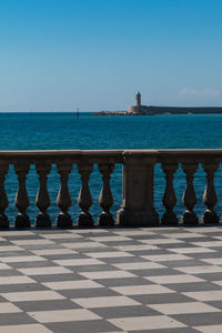 Scenic view of sea against clear blue sky