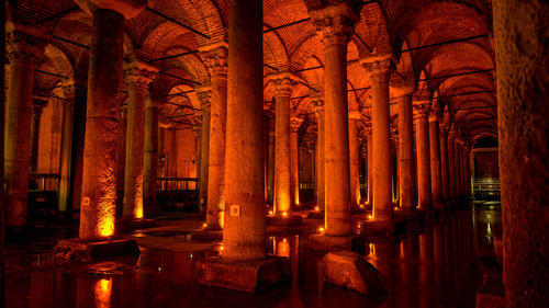 View of illuminated colonnade in building
