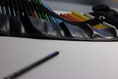 Close-up of colored pencils on table