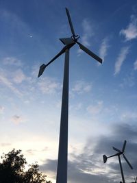 Low angle view of windmill against sky