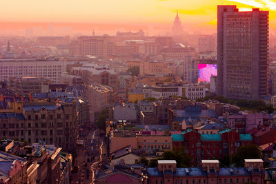 High angle view of city buildings during sunset