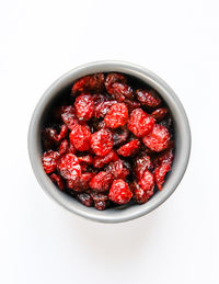 Directly above shot of strawberries in bowl against white background