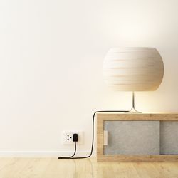 Close-up of electric lamp at home