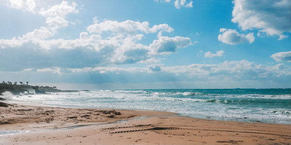 Scenic view of beach against sky