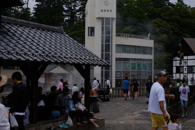 Group of people standing outside building