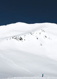 Scenic view of landscape against sky during winter