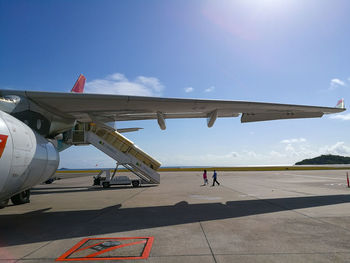 Man on airplane against sky