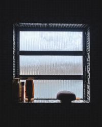 Man relaxing on window sill at home