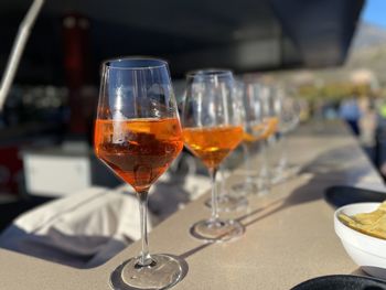 Close-up of wineglass of spritz on table