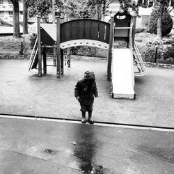 Full length of woman standing by railing