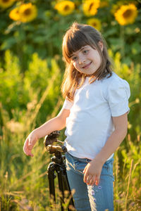 Portrait of smiling girl with bicycle