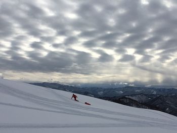 Scenic view of snowcapped mountain against sky