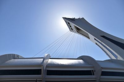 Low angle view of bridge against clear blue sky