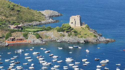 High angle view of boats in calm blue sea