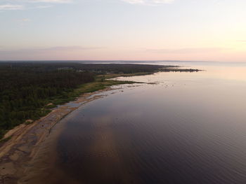 Scenic view of beach against sky during sunset