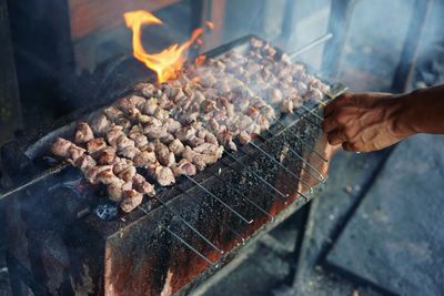 High angle view of meat cooking on barbecue grill