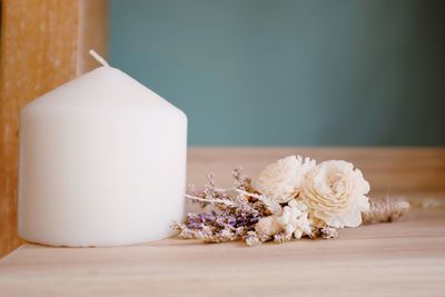 Close-up of white rose on table