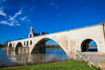 Arch bridge against blue sky