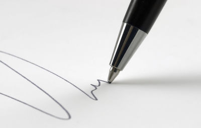 Close-up of pen over white background