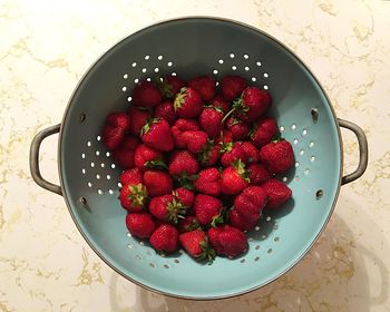 Directly above shot of strawberries in bowl on table