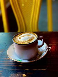 Close-up of coffee cup on table