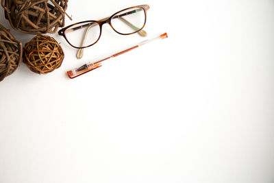 Close-up of eyeglasses against white background