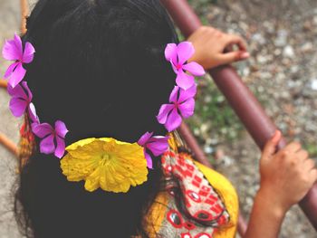 High angle view of teenage girl wearing flowers wreath