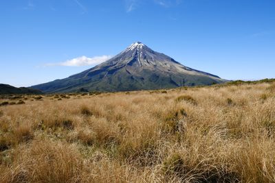 Scenic view of landscape against clear blue sky