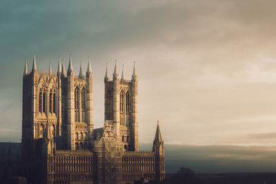 Panoramic view of buildings in city against sky