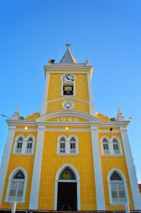 Low angle view of temple against clear blue sky