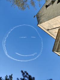 Low angle view of building against blue sky