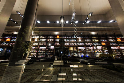 Low angle view of illuminated lighting equipment at home