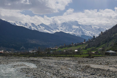 Scenic view of landscape and mountains against sky