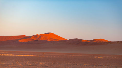 Scenic view of desert against clear sky