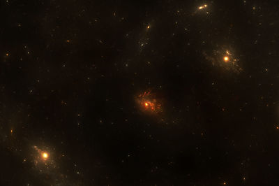 Low angle view of illuminated star field against sky at night