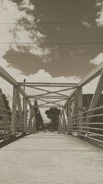 Narrow footbridge leading to bridge