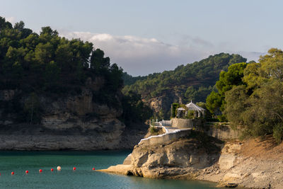 Scenic view of mountains and sea against sky