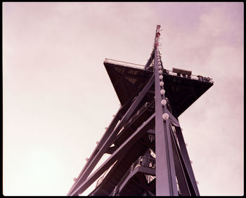 Low angle view of crane against sky