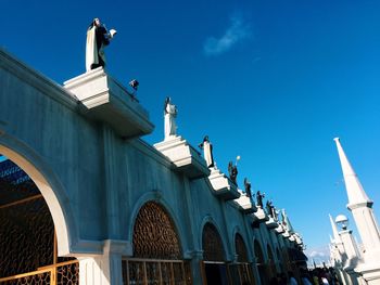 Low angle view of sculpture against sky