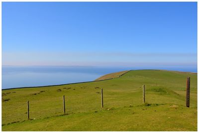 Scenic view of landscape against blue sky