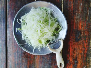 High angle view of chopped vegetables in bowl on table