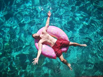 High angle view of boy swimming in pool