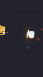 Close-up of illuminated lights in the dark