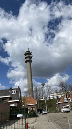 Low angle view of buildings in town against sky