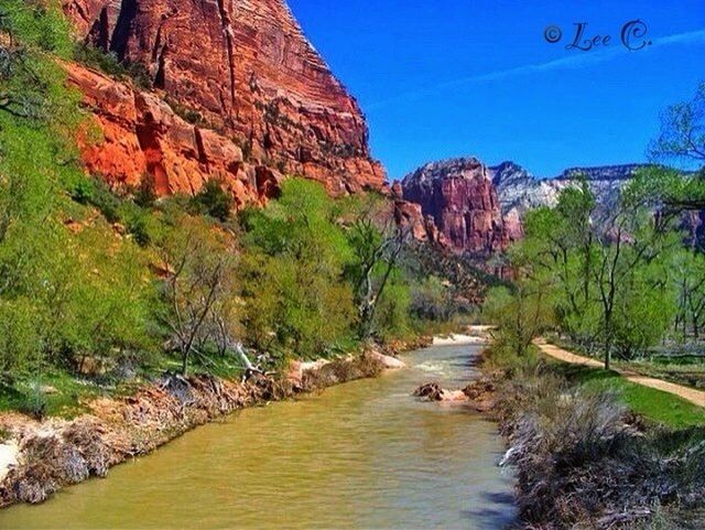 water, mountain, rock formation, rock - object, scenics, tranquil scene, tranquility, beauty in nature, nature, river, rock, stream, clear sky, rocky mountains, cliff, tree, non-urban scene, idyllic, blue, waterfront