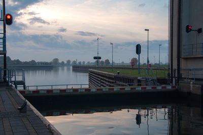 Scenic view of river against sky during sunset