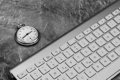 High angle view of clock on table